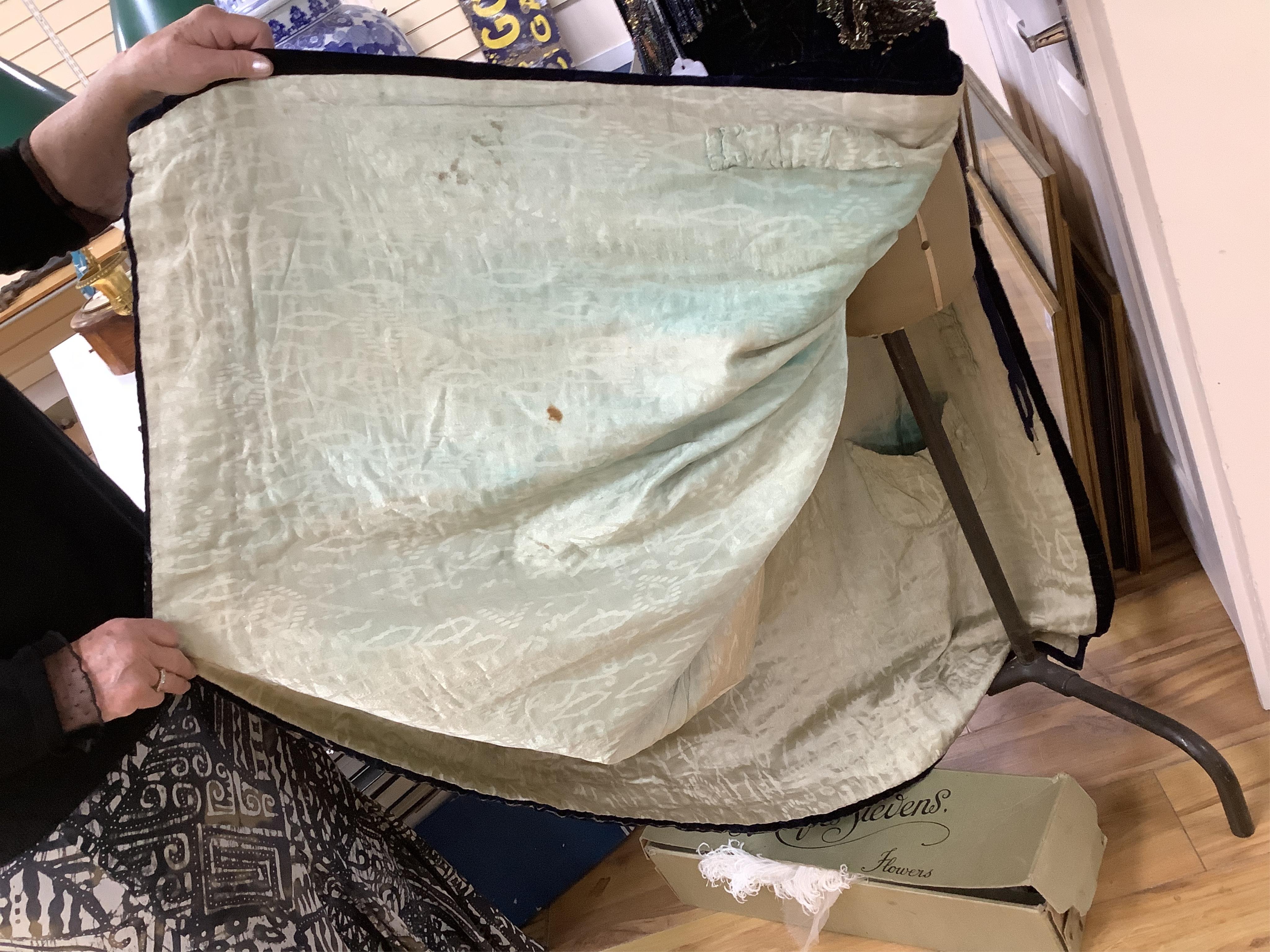 A 19th century ladies silk velvet matching long sleeved jacket/bodice, and skirt, together with another matching short sleeved bead worked bodice and white feather headdress.(4). Cape 106cm long. Condition - Both bodices